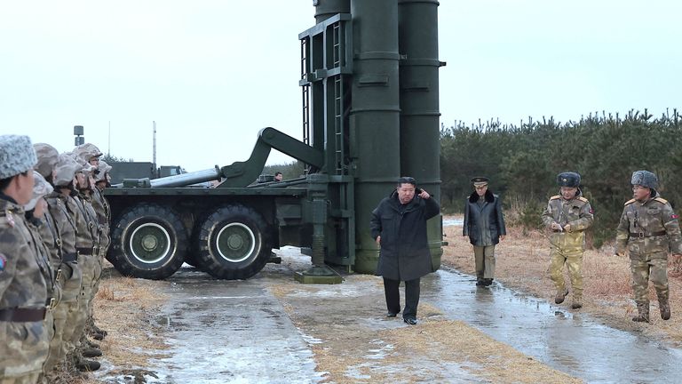 Mr Kim visits the site of a test-firing of a long-range surface-to-air missile near the East Sea
Pic: KCNA /Reuters