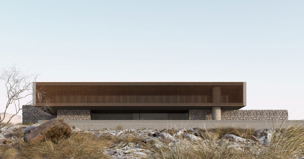 stone house by SHOVK perches over oceanfront slope in portugal