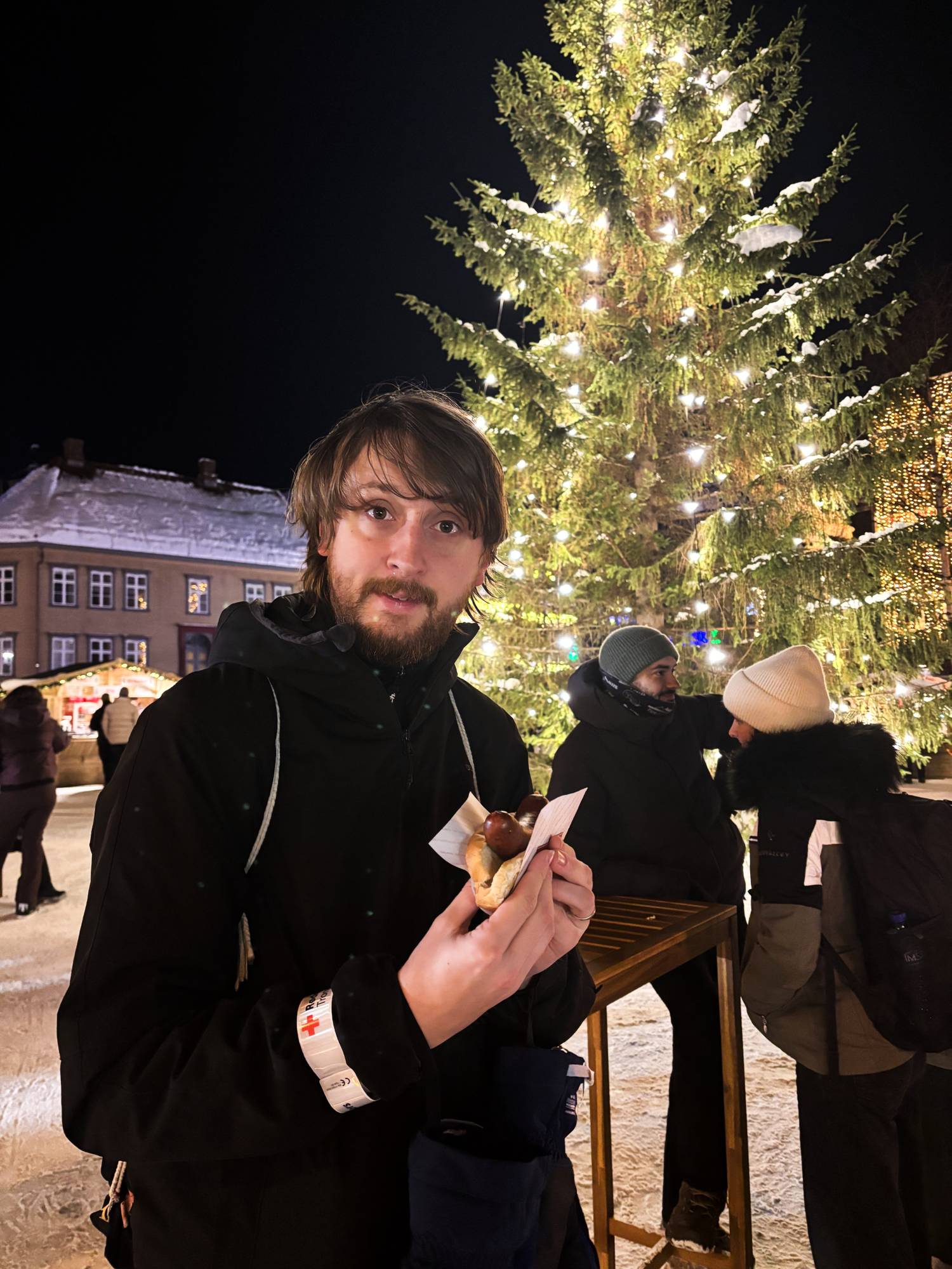 Tom Boon enjoys a reindeer sausage at the Christmas Market in Tromsø, Norway.