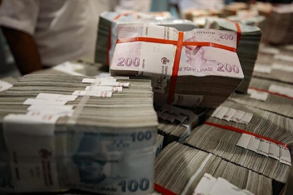 File photo shows stacked bundles of 100- and 200-lira banknotes, accessed on Dec. 16, 2025. (AA Photo)