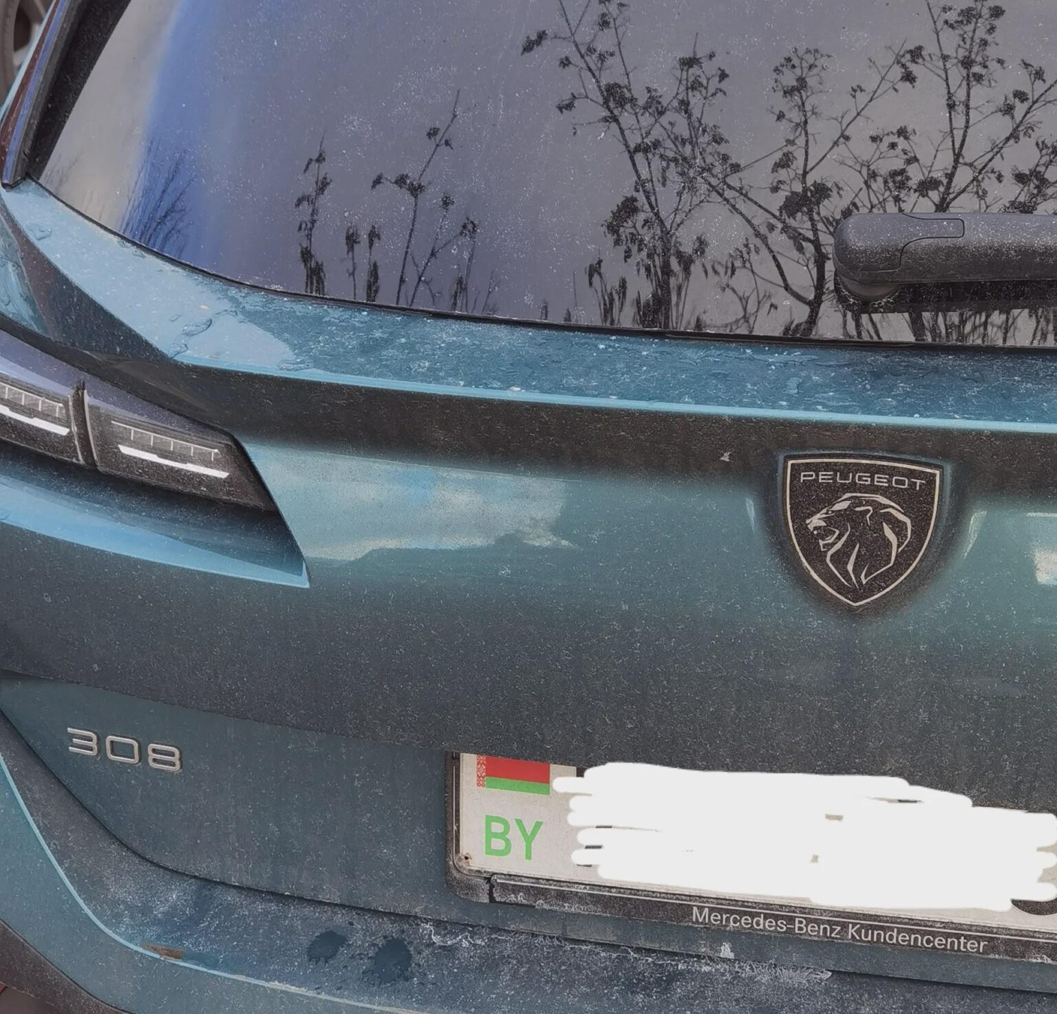 Why Belarusians drive Peugeots with Mercedes-Benz license plate frames? Is this a direct result of Lukashenka regime dictatorship?