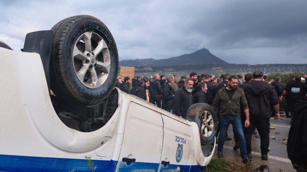 Angry Greek farmers swarm onto the tarmac at Crete airport