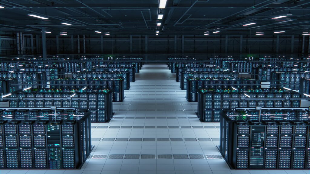 These Artificial Intelligence (AI) Stocks Are Up 257% and 316% So Far in 2025. Here’s Why They Could Be a Bust in 2026. A data center with rows of server racks.