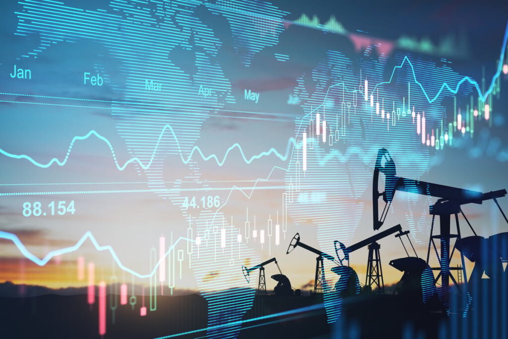Here Are My Top 3 Energy Stocks to Buy Now Oil pumps with a price chart in the background.