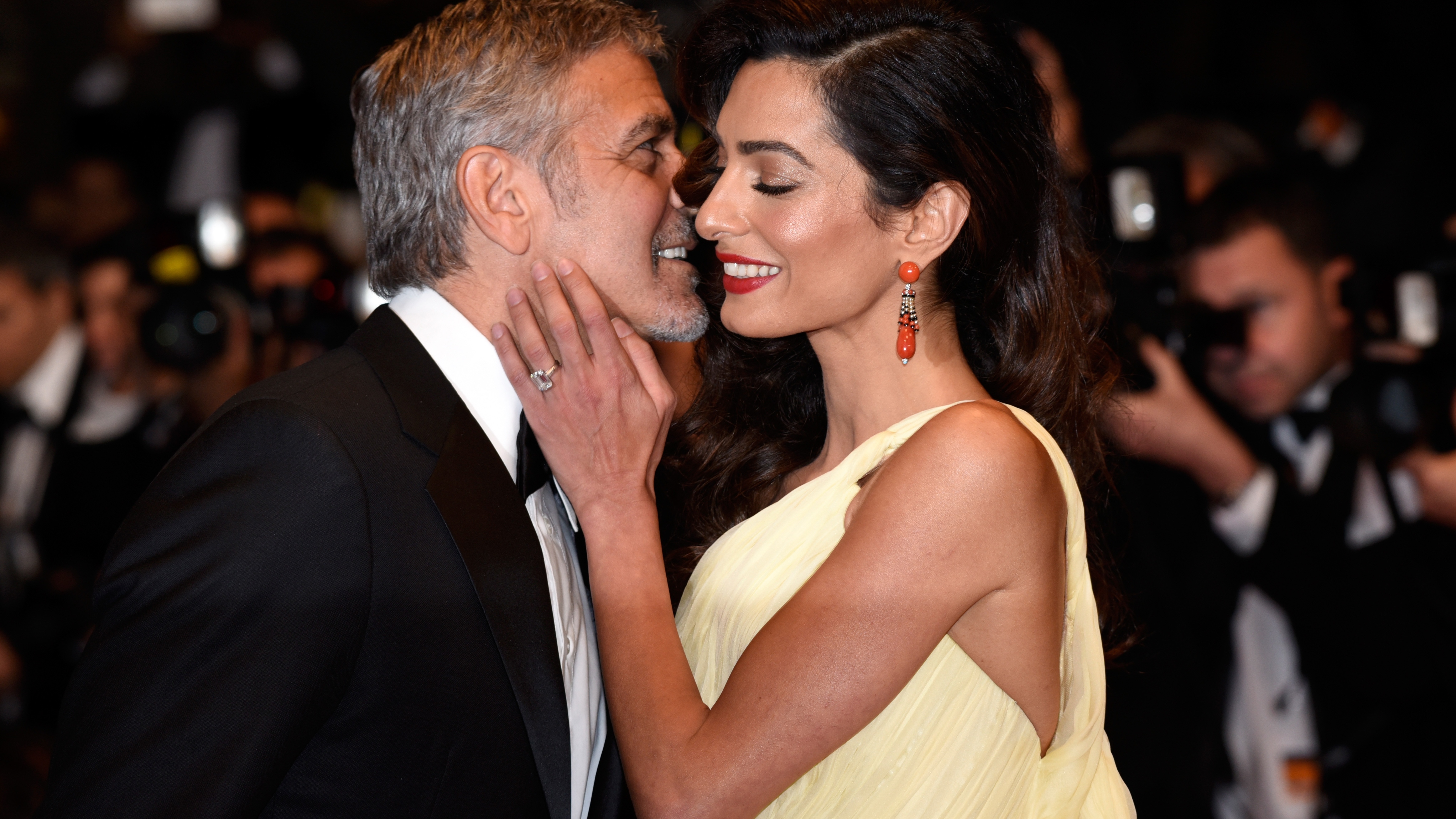 Actor George Clooney and his wife Amal Clooney attend the "Money Monster" premiere during the 69th annual Cannes Film Festival at the Palais des Festivals on May 12, 2016 in Cannes, France. (Photo by Clemens Bilan/Getty Images)