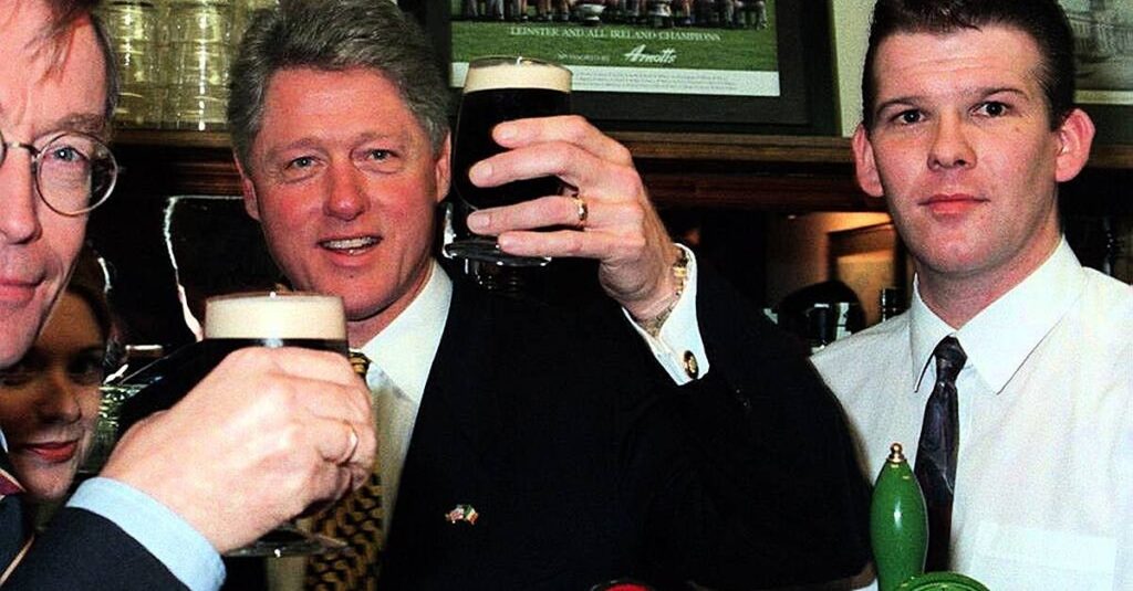 White House did not want photo of Clinton shaking Adams’ hand during 1995 visit