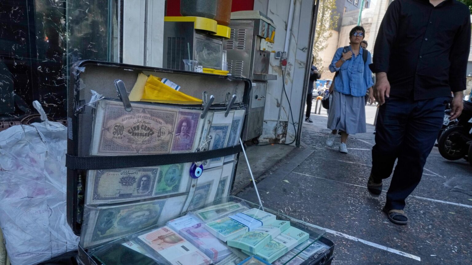 Iran's currency falls to a new low as nuclear sanctions squeeze its ailing economy