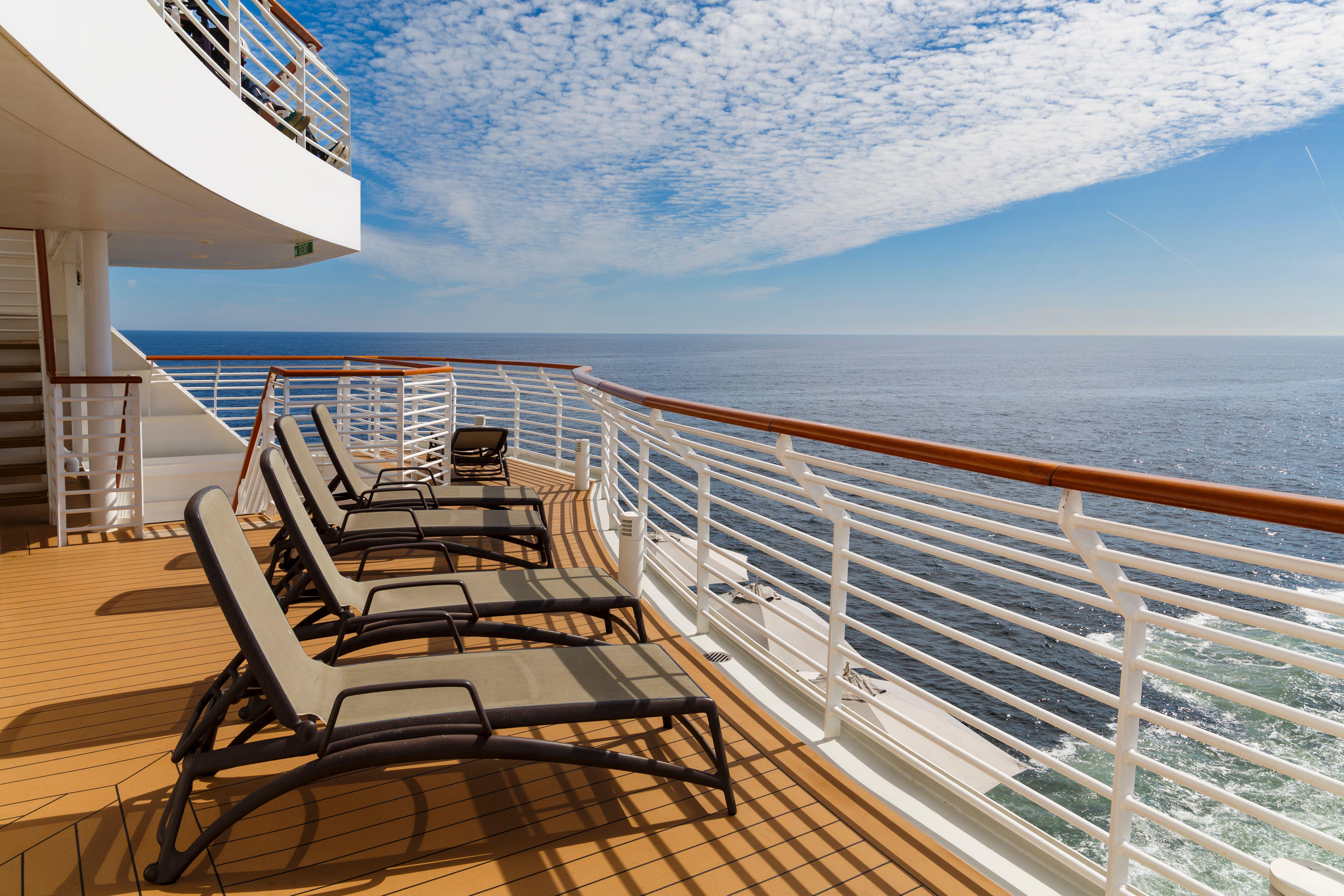 Empty sun loungers on the deck of the Saga Spirit of Adventure cruise ship, with the sea visible in the background.