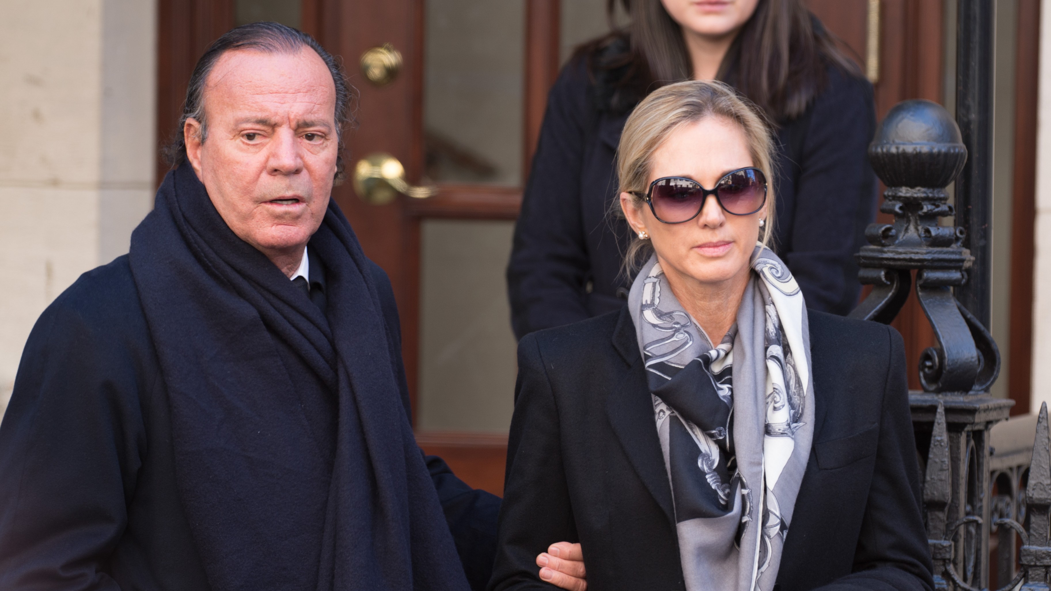 Julio Iglesias and his wife Miranda Rijnsburger departing Oscar De La Renta's funeral.