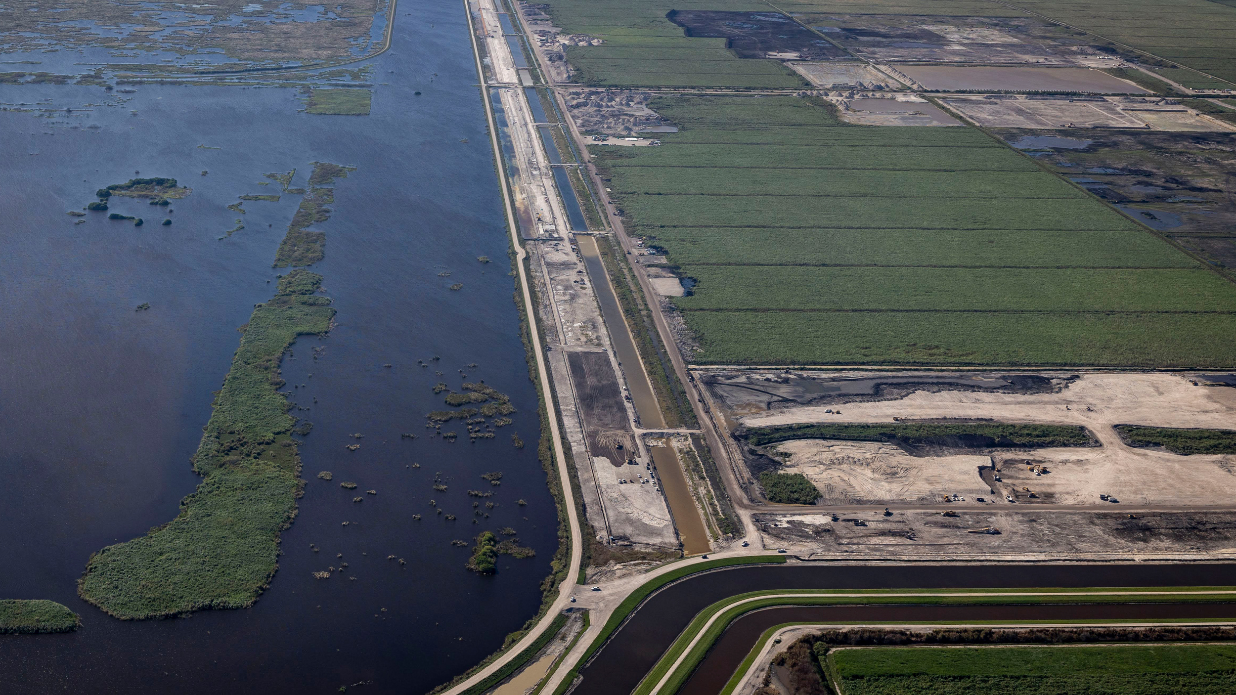 The construction site of the Everglades Agricultural Area reservoir, to the right, lies alongside a flow equalization basin, designed to store stormwater. Credit: Jose Iglesias/Miami Herald