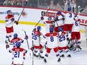 Czechia players celebrate their team's win over Canada in a semifinal game of the IIHF World Junior Hockey Championship  on Jan. 4, 2026, in St. Paul, Minn. 