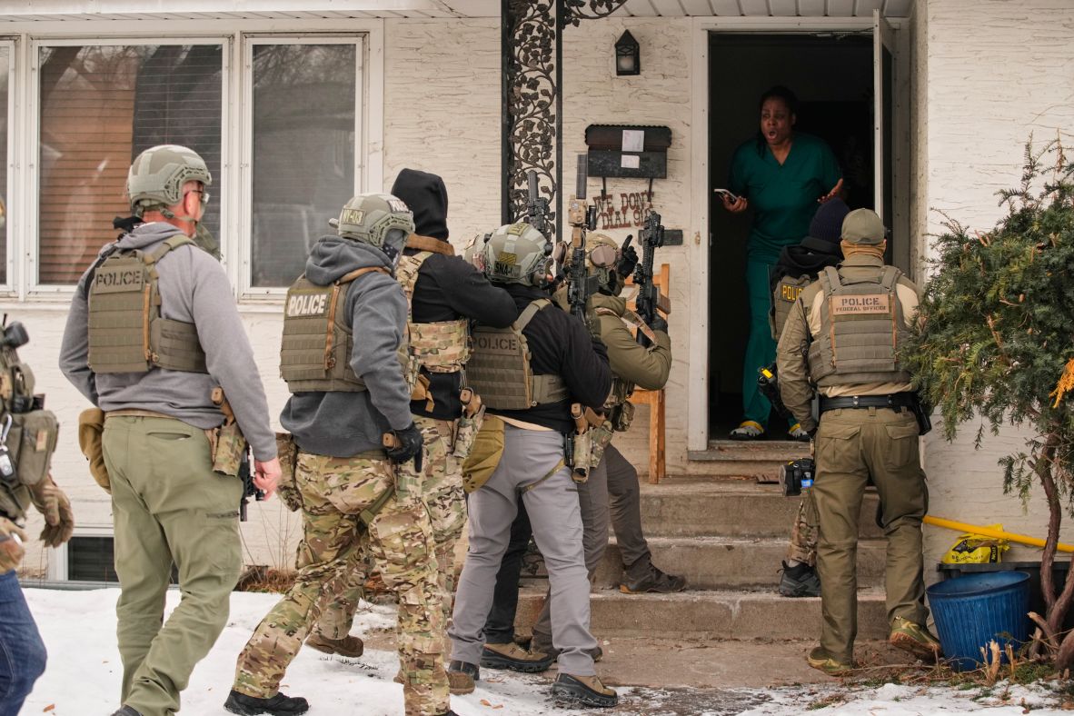 Teyana Gibson Brown reacts after a federal immigration officer used a battering ram to break down a door before arresting her husband, Garrison Gibson, in Minneapolis on January 11.