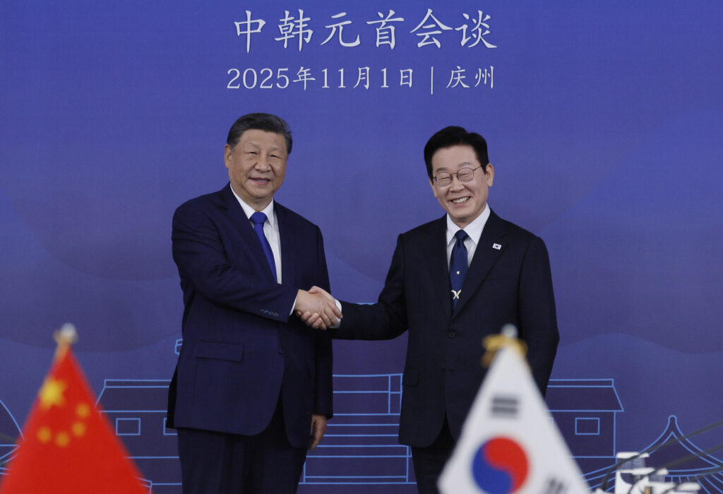 Korean President Lee Jae Myung, right, shakes hands with Chinese President Xi Jinping during their bilateral summit at the Gyeongju National Museum in Gyeongju, North Gyeongsang, on Nov. 1, 2025. [JOINT PRESS CORPS]