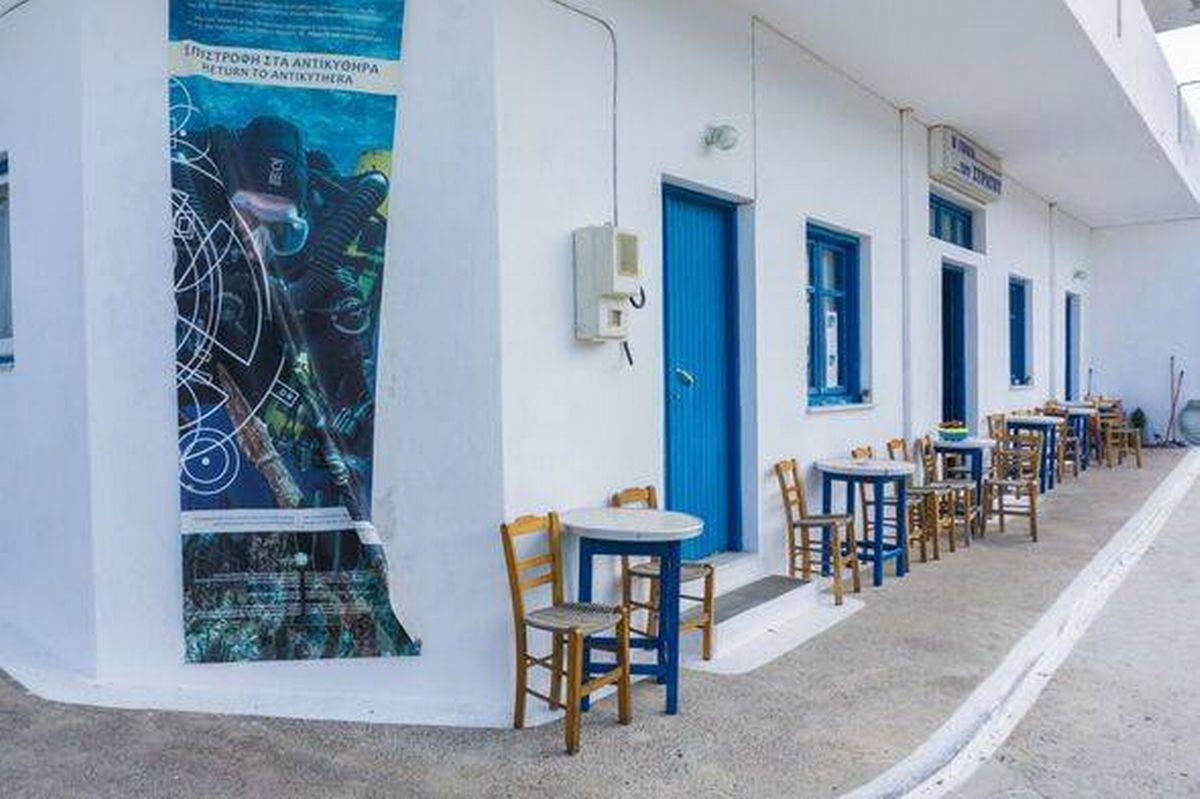 Street view of Potamos village with narrow alleys and traditional architecture in Antikythera island in Greece
