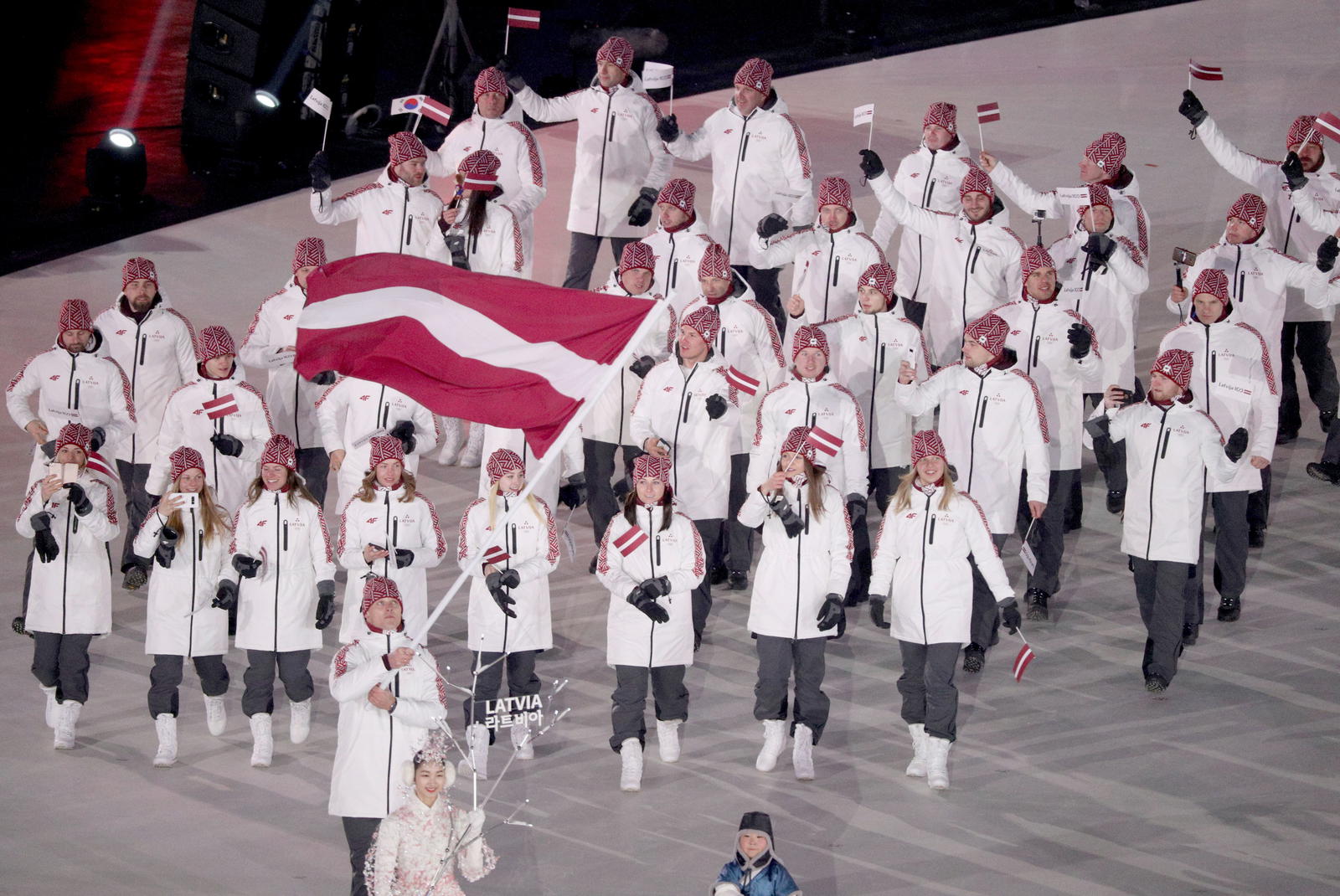 Team Latvia athletes walk during the opening ceremony of the Pyeongchang 2018 Olympic Winter Games at Pyeongchang Olympic Stadium (Source: Matt Kryger-Imagn Images)