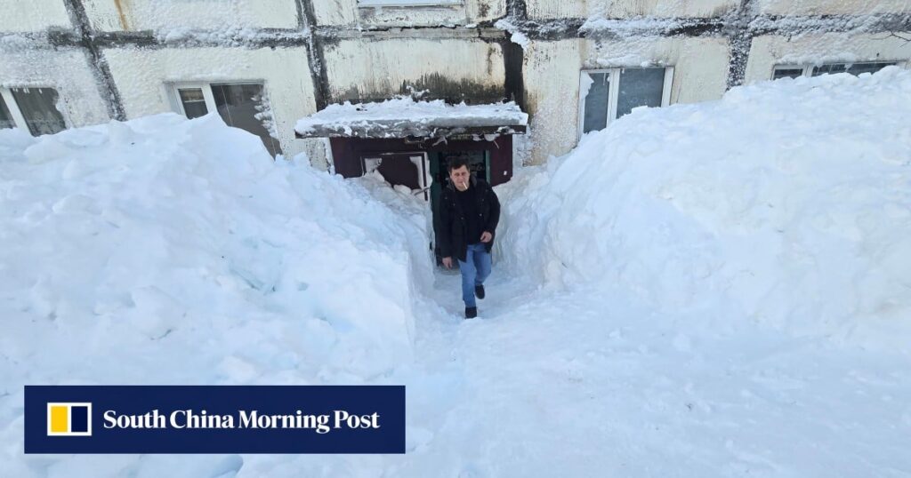 Record snow in Russia’s far east blocks building entrances, buries cars