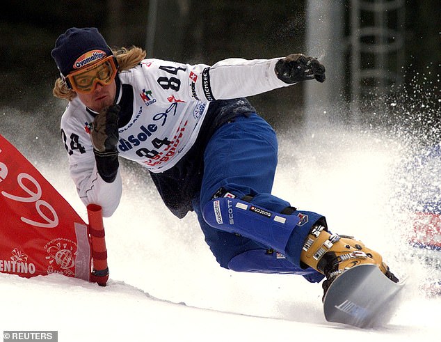 Ueli Kestenholz is seen competing in the men's duel slalom in Italy. No year is provided