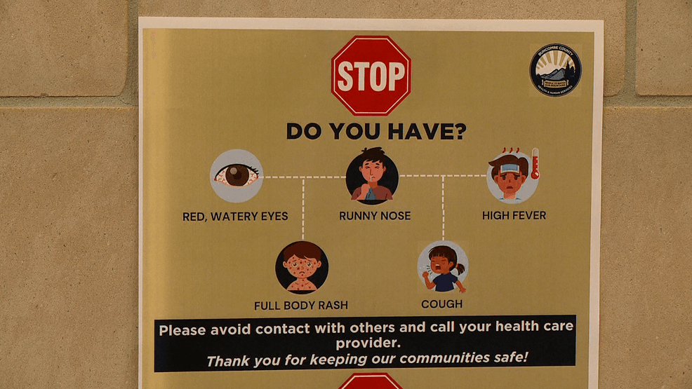 JAN. 6, 2026 - A flyer in Buncombe County warning of illness symptoms amid three confirmed measles cases in the county. (Photo credit: WLOS Staff){p}{/p}