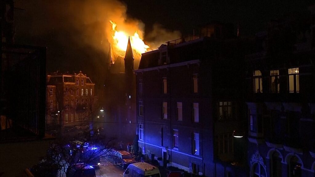 Two dead and church gutted by fire in 'unprecedented' New Year's violence in the Netherlands