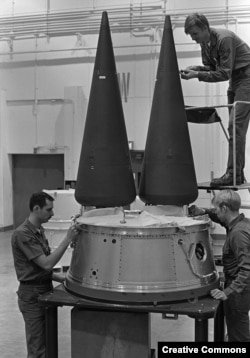 Technicians install reentry vehicles on a Minuteman III intercontinental ballistic missile at a US Air Force base in Montana in 1985.