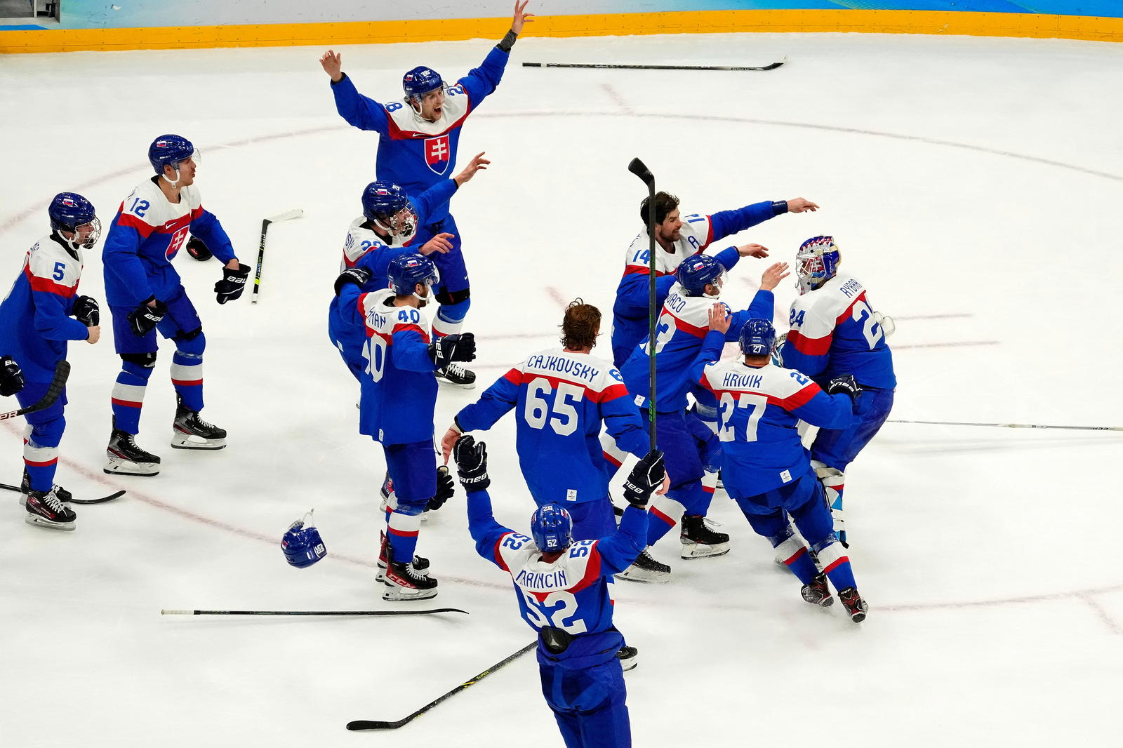 Slovakia celebrate winning the bronze medal men s ice hockey game against Sweden during the Beijing 2022 Olympic Winter Games( Source: George Walker IV-Imagn Images)