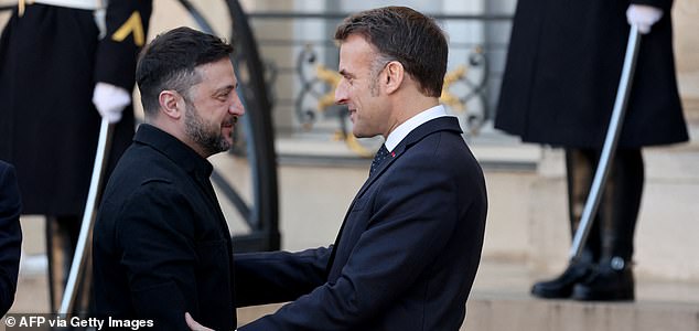 France's President Emmanuel Macron (R) welcomes Ukraine's President Volodymyr Zelensky at the Elysee Palace in Paris, on January 6, 2026, prior to the Coalition of the Willing summit on security guarantees for Ukraine. The summit of the group of Ukraine supporters dubbed the "Coalition of the Willing" is the latest of several meetings planned for the new year as diplomatic efforts to end Europe's deadliest conflict since World War II have gained pace in recent weeks. (Photo by Ludovic MARIN / AFP via Getty Images)