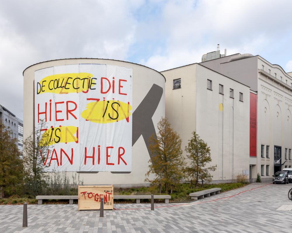 Protest banners hang from the exterior of the M HKA museum in Antwerp