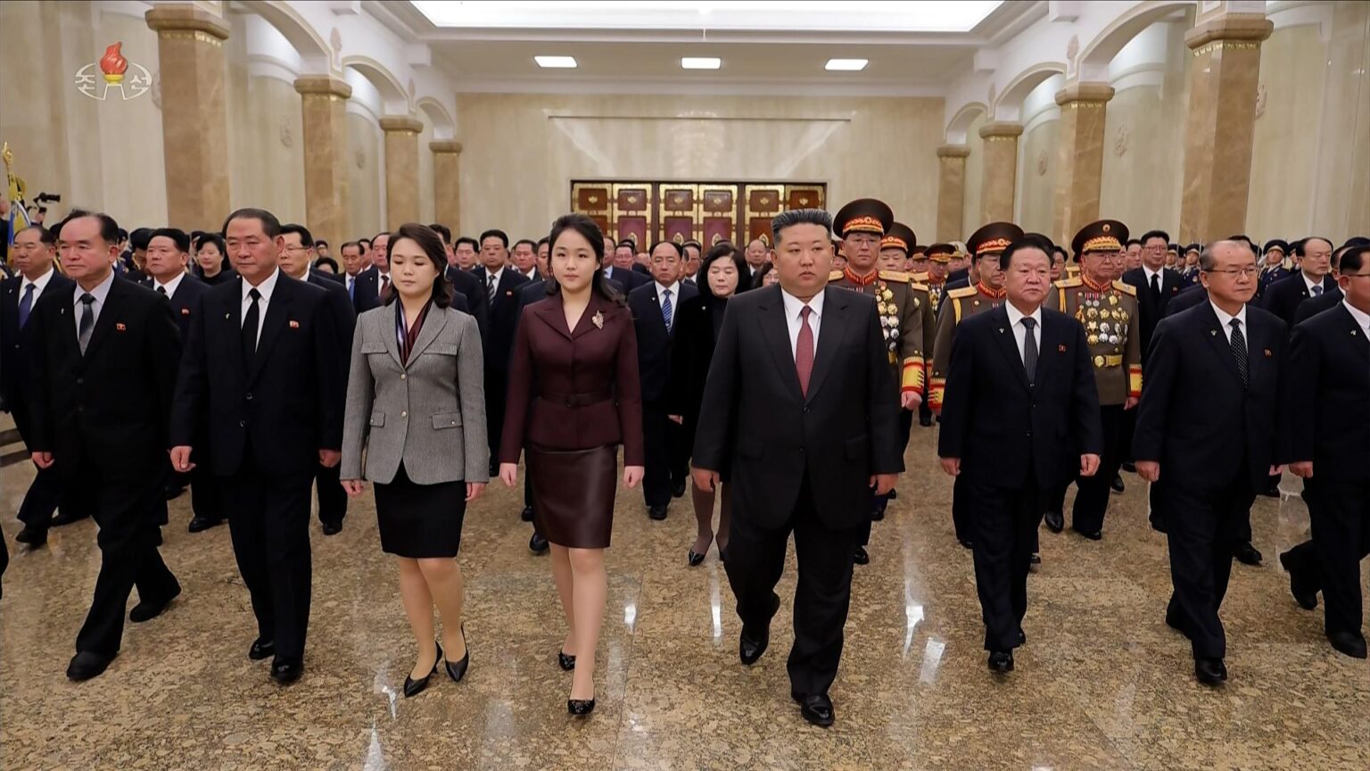North Korean leader Kim Jong-un, fifth from left, alongside his daughter, Ju-ae, fourth from left, and his wife, Ri Sol-ju, third from left, visits the Kumsusan Palace of the Sun on Jan. 1, in this photo released by the North