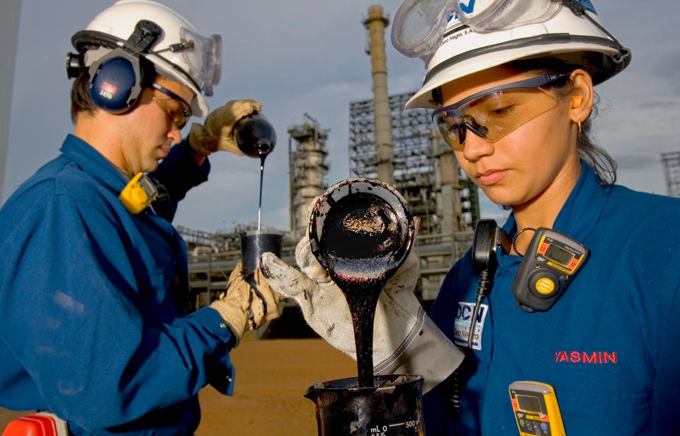 Cerro Negro Refinery Venezuela in 2004, with workers showing heavy oil typical of the Orinoco Belt. 