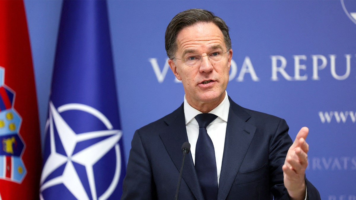 The NATO leader addresses reporters from a podium during an official visit to Croatia.