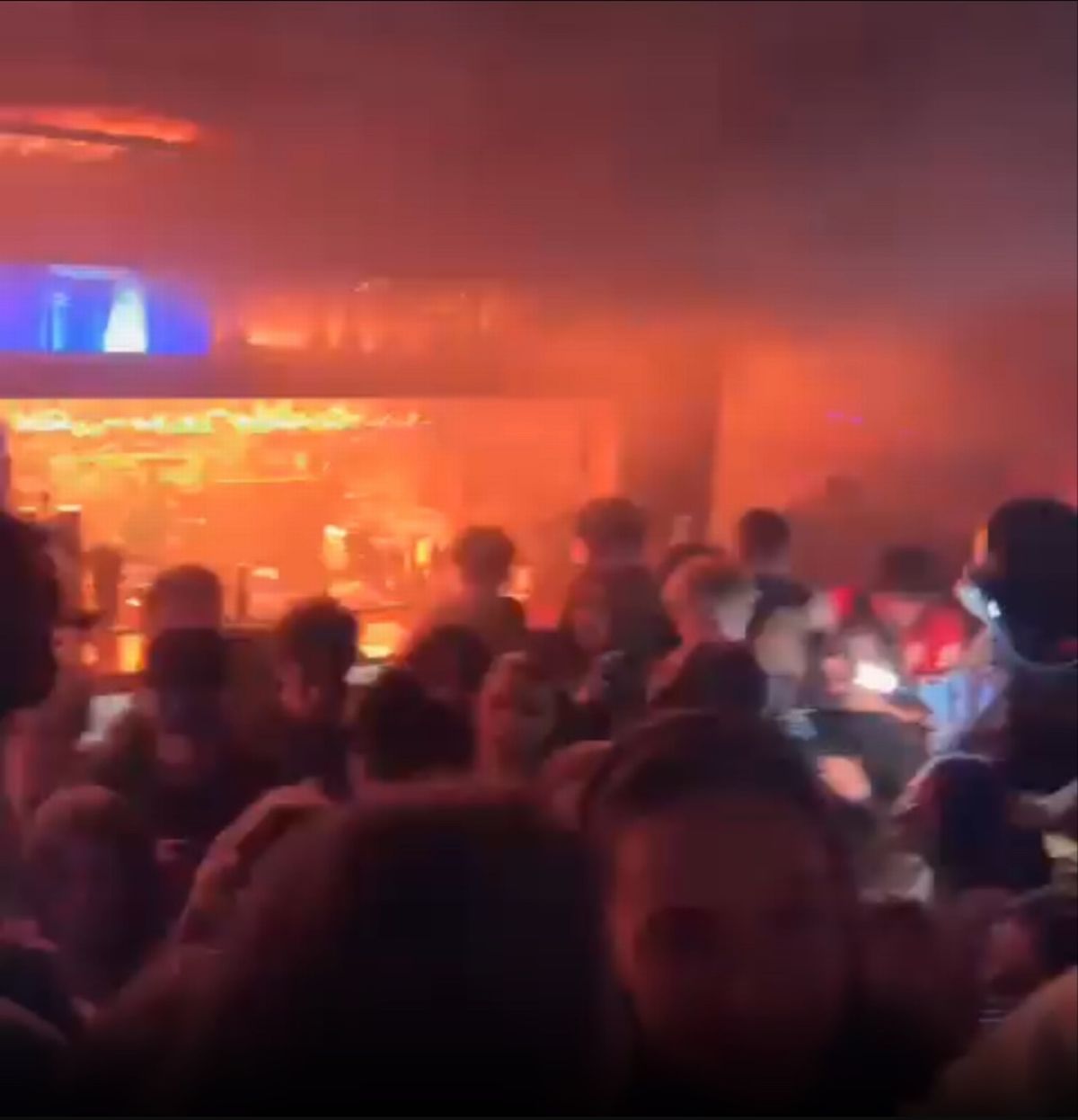 Stunned partygoers were seen inside the bar after it caught fire, with the flames quickly leaping across the ceiling after they ignited on Thursday. 