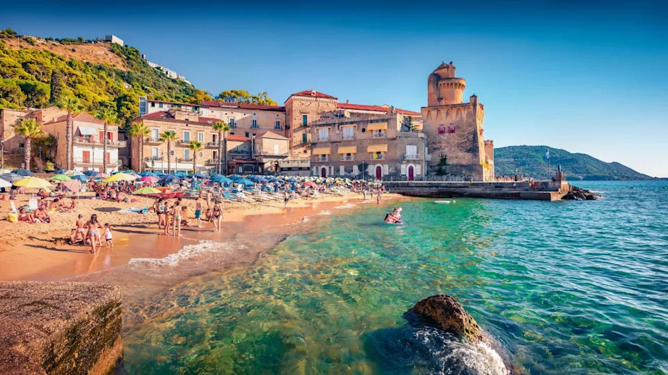 Hot summer day on Santa Maria di Castellabate puclic beach, Italy, Europe. Wonderful outdoor scene of italian resort. Vacation concept background.