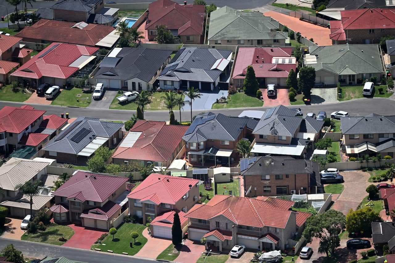 An aerial view of rows of large houses.