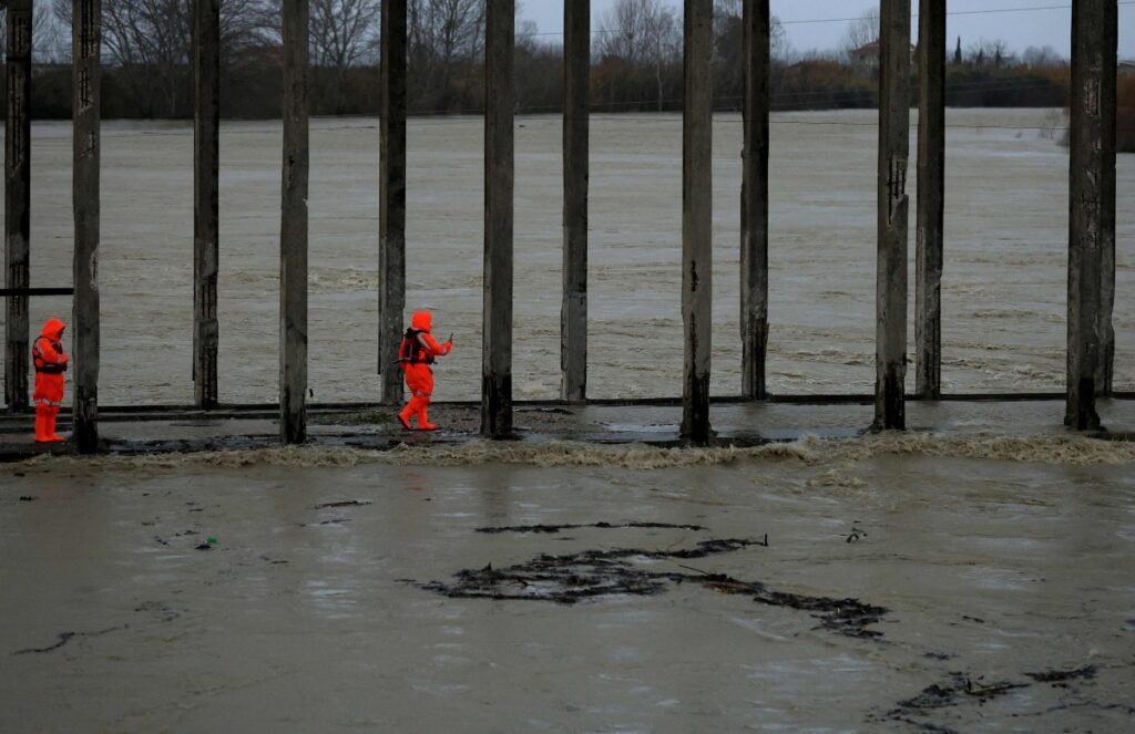Members of the Civil Emergencies services monitor the Vjosa River in the village of Novosele, near Vlore on January 8, 2026. Photo by Adnan Beci / AFP
