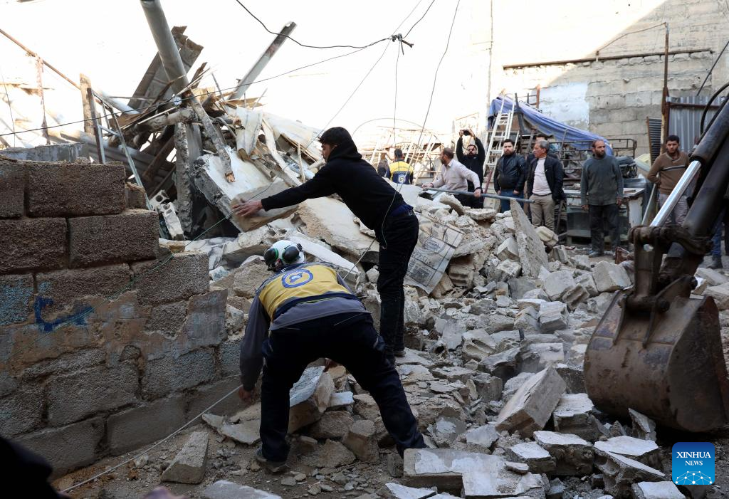 Rescue workers remove rubble of collapsed building in Syria-Xinhua