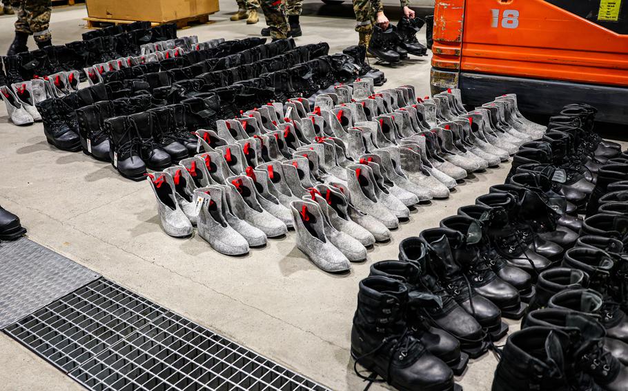 Shoes are lined up for inspection in preparation for an exercise.
