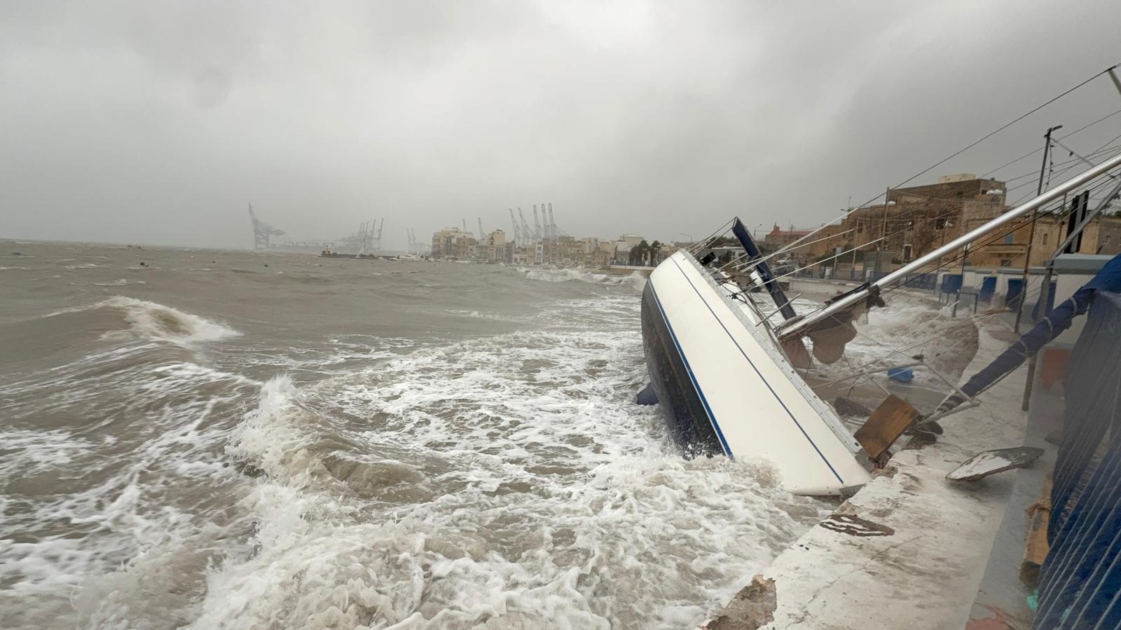 A boat crashes up against the wall in Birżebbuġa. Photo: Jonathan Borg