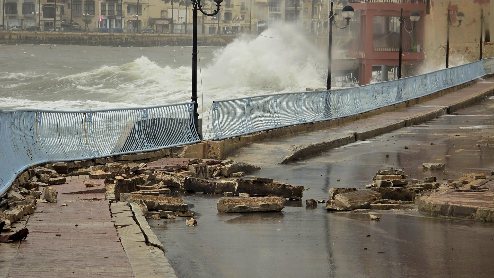 The pavement on Triq iz-Zonqor heavily damaged by rough seas on Monday evening. Photo: Angie Hoover