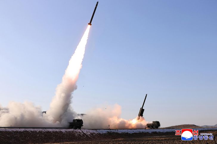 North Korea test-fires an upgraded large-caliber multiple rocket launcher system, Tuesday, in this photo published by the Korean Central News Agency the following day. Yonhap