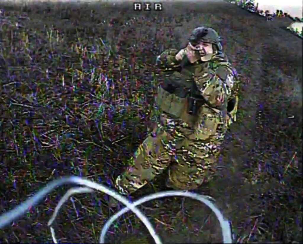 Last frame of overweight russian soldier before he is struck by Ukrainian FPV drone