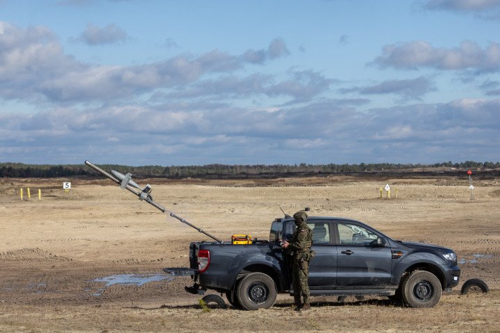 A Polish soldier launches an interception drone of the American MEROPS counter drone system during tests at the Nowa Deba military training ground, south-eastern Poland, on November 18, 2025. (Source: Getty Images) A Polish soldier launches an interception drone of the American MEROPS counter drone system during tests at the Nowa Deba military training ground, south-eastern Poland, on November 18, 2025. (Source: Getty Images)