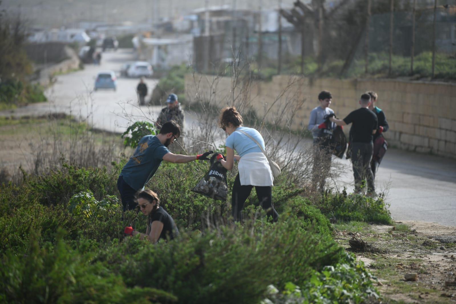 Volunteers in Bahar ic-Caghaq cleaning debris after the storm Photo: Matthew Mirabelli