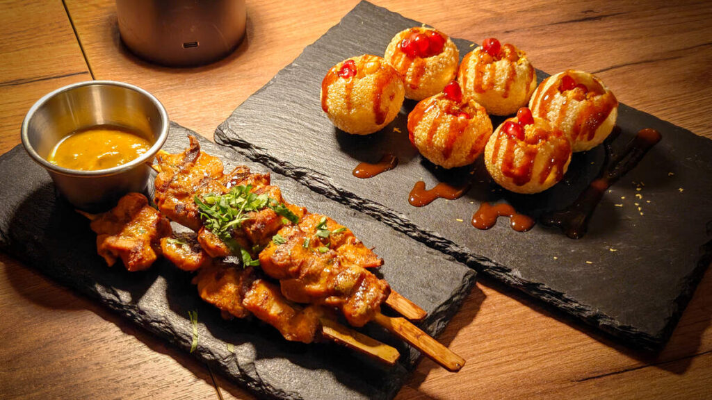 Chicken thigh skewers and dahi puri were among the sharing plates sampled