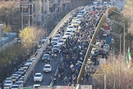 Protesters march in downtown Tehran, Iran, on Monday, Dec. 29, 2025.