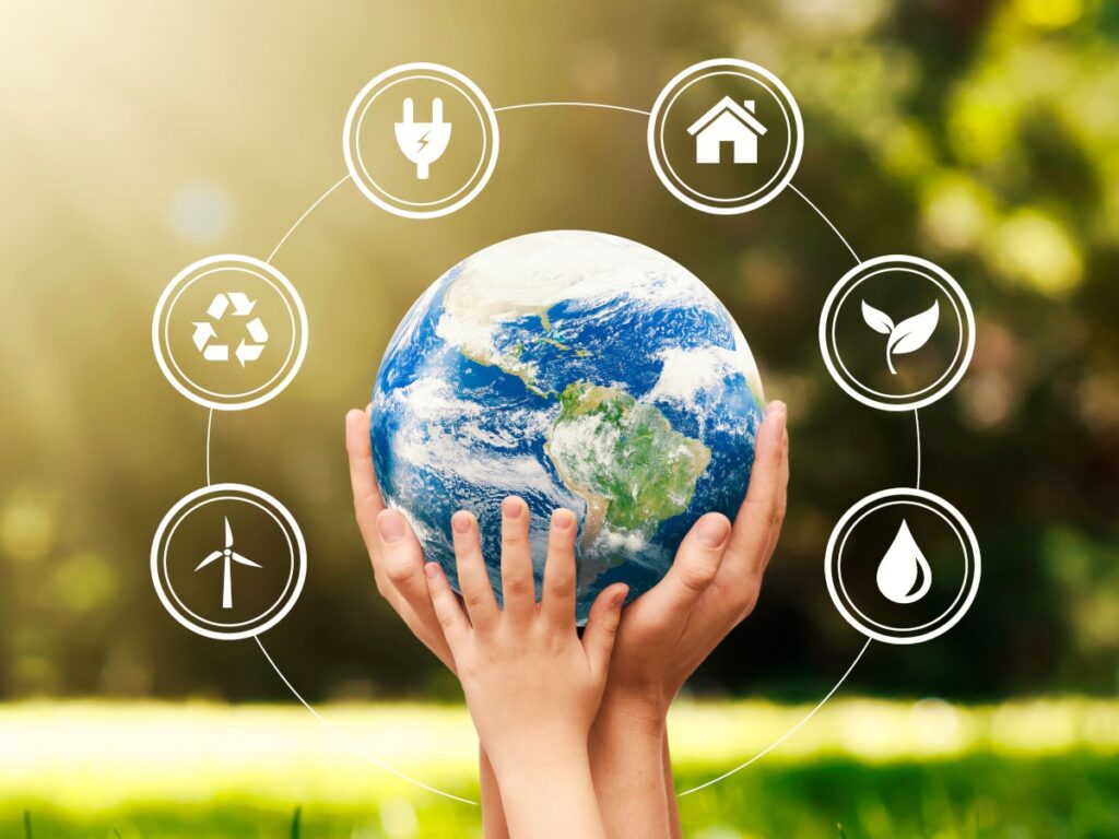 Children holding up a model of the globe, which is surrounded by climate crisis iconography.