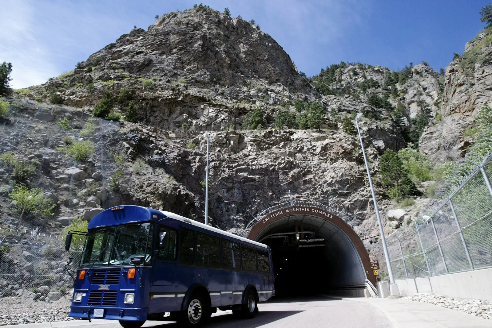 At the entrance to the Cheyenne Mountain Complex headquarters for NORAD a military shuttle bus exits the mountain May 11, 2004 in Colorado Springs, Colorado.