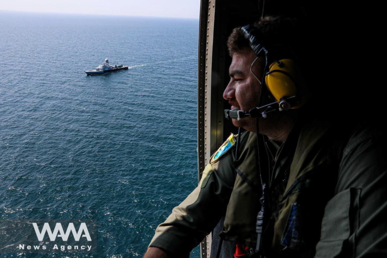 An Iranian Army helicopter crew member is seen during a joint naval military drill between Iran, Russia, and China in the Gulf of Oman, Iran March 15, 2023. Iranian Army/WANA (West Asia News Agency)