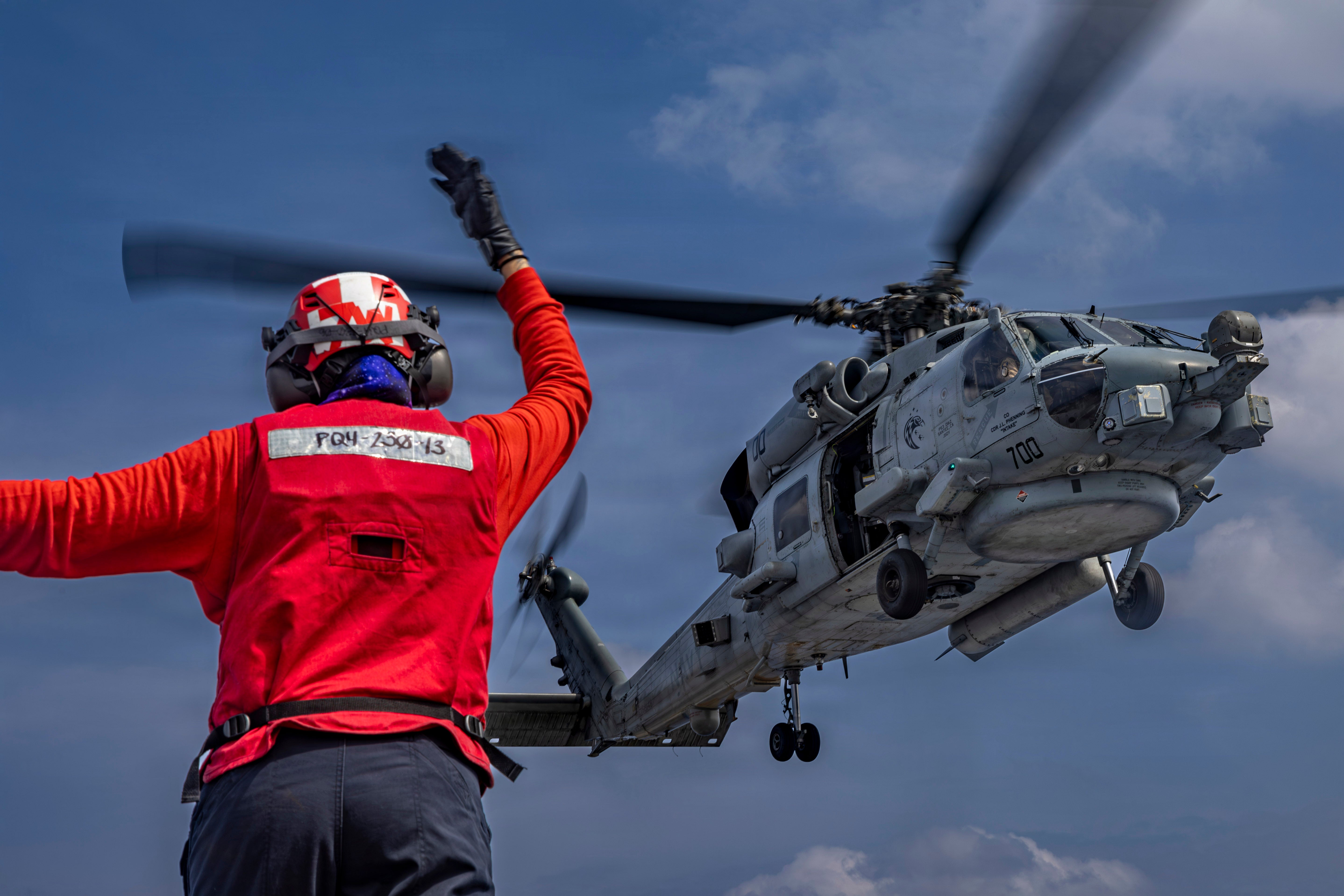 An MH-60R Sea Hawk helicopter on the flight deck of the Nimitz-class aircraft carrier USS Abraham Lincoln in the Indian Ocean on Jan. 21, 2026