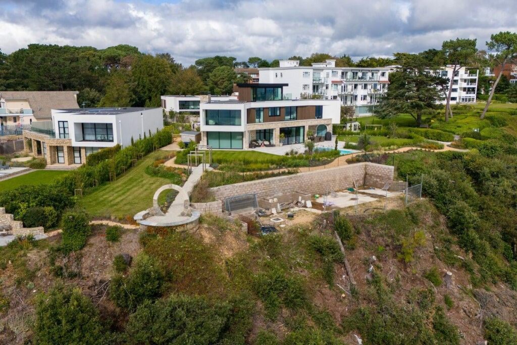 Millionaire who felled 28 trees to create room for clifftop pool fined £20,000