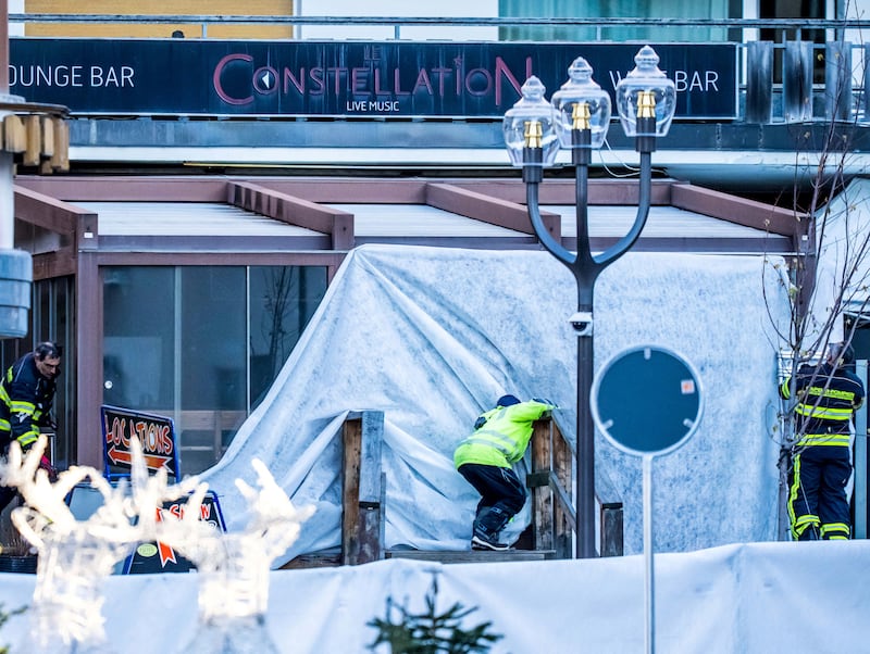 Rescuers and firefighters work at the site of a fire that ripped through a bar in Crans-Montana. Photograph: Maxime Schmid/AFP via Getty Images